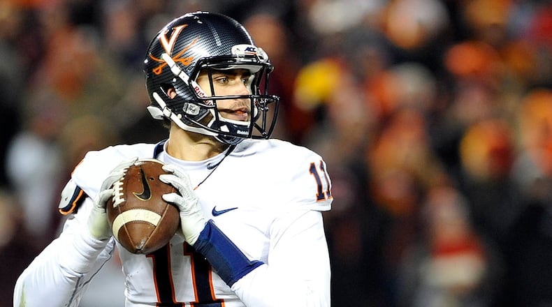 Bulldogs are recruiting Greyson Lambert, a quarterback who started nine games at Virginia last year.