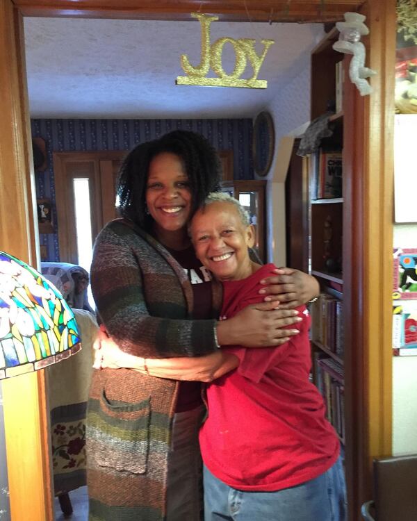 Joy: Atlanta novelist Tayari Jones embraces poet Nikki Giovanni. In 2003 Giovanni invited the young writer to Virginia to talk about writing and build a sisterhood. (Courtesy)
