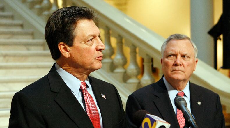Congressman Lynn Westmoreland, left, answers a question with Georgia Governor Nathan Deal looking on during a press conference at the Georgia State Capitol in Atlanta in 2011. Curtis Compton ccompton@ajc.com