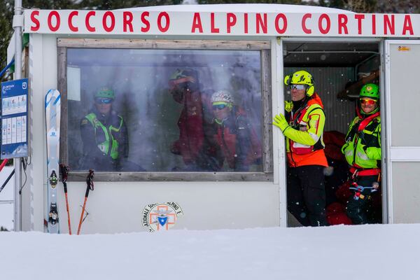 A rescue team waits at their base during a training with the Italian National Alpine and Speleological Rescue Corps in Col Gallina, near Cortina D'Ampezzo, northern Italy, Tuesday, March 25, 2025. (AP Photo/Luca Bruno)