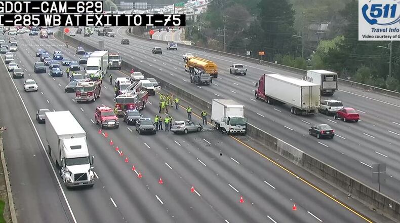 A fatal crash and fire is blocking several lanes westbound lanes of I-285 in Cobb County, according to police.