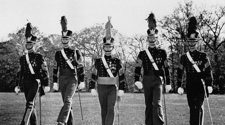 Cadet Donald Trump, second from left, marches in the uniform and plumed hat of the New York Military Academy in 1964.
