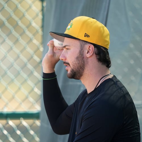 Pittsburgh Pirates' Paul Skenes watches a workout during spring training baseball Saturday, Feb. 14, 2026, in Bradenton, Fla. (AP Photo/Matt Slocum)