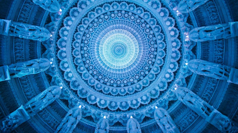 A stone chandelier hangs from the central dome of BAPS Shri Swaminarayan Mandir in Lilburn. It features stacked marble rings trimmed with LED lighting and is surrounded by 16 figures that represent the stages of a Hindu person’s life. Contributed by BAPS Shri Swaminarayan Mandir