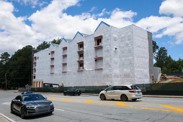 A housing project is shown under construction on Clairmont Road last week in Chamblee. DeKalb County's housing chief, Alan Ferguson, said this is an example of an affordable senior apartment project. This 67-unit project is being developed by Mercy Housing Southeast and supported by federal funds. (Jason Getz/AJC)