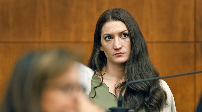 Lindsay Clancy waits for the judge to call a prospective jury member into court in her murder trial where she is charged in the 2023 killing of her three children, Wednesday, July 22, 2026, in Plymouth Superior Court in Plymouth, Mass. (Greg Derr/The Patriot Ledger via AP, Pool)