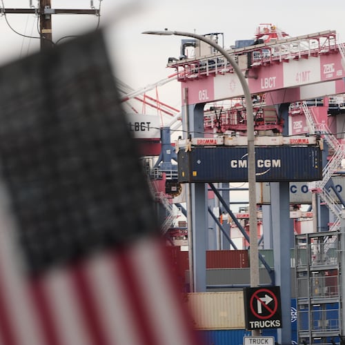 A U.S. flag files at the Port of Long Beach Friday, Feb. 20, 2026, in Long Beach, Calif. (AP Photo/Damian Dovarganes)