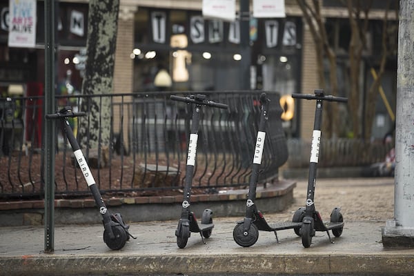 01/04/2019 — Atlanta, Georgia — Bird Scooters sit parked on the sidewalk of Euclid Avenue NE in Atlanta’s Little Five Points community, Friday, January 4, 2019. (ALYSSA POINTER/ALYSSA.POINTER@AJC.COM)