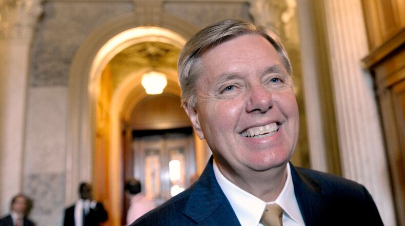 FILE - Sen. Lindsey Graham, R-S.C., speak with reporters following a vote on student loans on Capitol Hill in Washington, May 8, 2012. (AP Photo/Susan Walsh, File)
