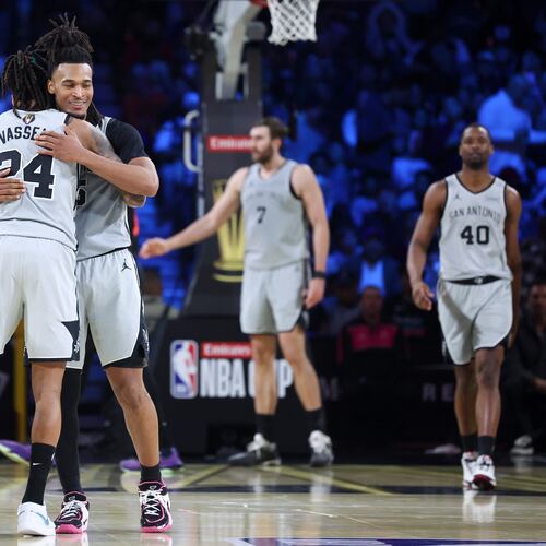 San Antonio Spurs guard Devin Vassell (24) and Stephon Castle react after a basket against the New York Knicks during the second half of the NBA Cup championship basketball game Tuesday, Dec. 16, 2025, in Las Vegas. (AP Photo/Ian Maule)
