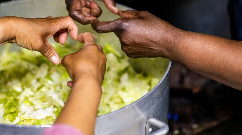 Volunteers work with food at the Grandma's Hands project in Oregon that seeks to teach healthy nutrition and reduce food insecurity. CIVIL EATS