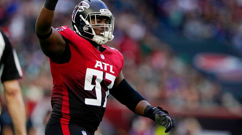 Atlanta Falcons defensive tackle Grady Jarrett (97) reacts after a play during an NFL football game against the New York Jets at Tottenham Hotspur Stadium in London, Sunday, Oct. 10, 2021. (AP Photo/Steve Luciano)