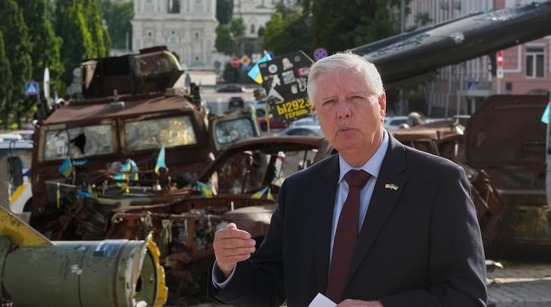 FILE - U.S. Sen. Lindsey Graham, R-S.C. answer media questions near damaged Russian vehicles exhibition in central Kyiv, on July 10, 2026. (AP Photo/Efrem Lukatsky, File)
