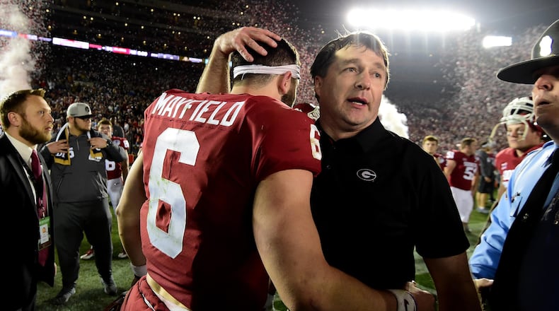 PASADENA, CA - JANUARY 01: Head Coach Kirby Smart of the Georgia Bulldogs hugs quarterback Baker Mayfield #6 of the Oklahoma Sooners after the Bullsdogs beat the Oklahoma Sooners 54-48 in double overtime in the 2018 College Football Playoff Semifinal Game at the Rose Bowl Game presented by Northwestern Mutual at the Rose Bowl on January 1, 2018 in Pasadena, California. (Photo by Harry How/Getty Images)