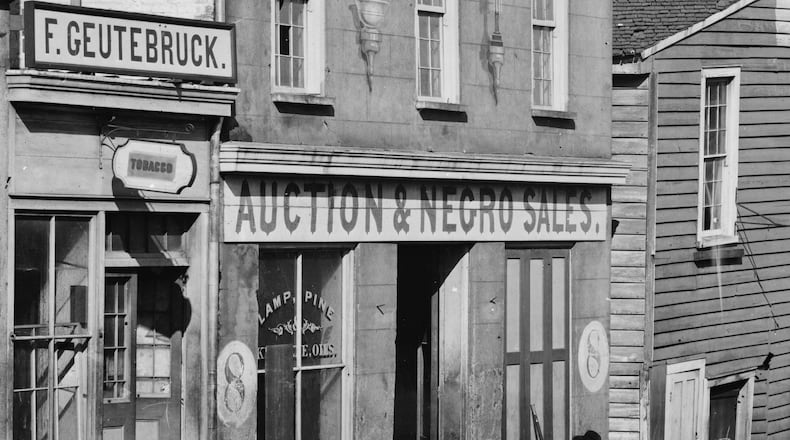Teaching students about slavery can be complicated. Some educators have come under fire for using creative ways to explain a complex issue. Experts suggesting sticking as close as possible to approved materials and consulting vetted sources for accurate information. In this historical photo, a black Union corporal reads a book while he is posted outside an Atlanta building that had been used as a slave market. The building was on Whitehall Street (modern-day Peachtree Street). The same site, 150 years later, is the Five Points MARTA station downtown. This photo was taken by Civil War photographer George N. Barnard during the Union occupation of Atlanta in 1864. Source: Library of Congress.