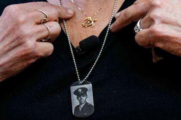 Diane Christie wears a necklace with a photograph of her uncle, World War II U.S. Army Air Forces 2nd Lt. Thomas Kelly, inside Santos Robinson Mortuary, Friday, May 23, 2025, in San Leandro, Calif. whose remains had been missing since being killed when the World War II bomber nicknamed Heaven Can Wait was hit by anti-aircraft fire and crashed into the water off the coast of New Guinea on March 11, 1944. (AP Photo/Godofredo A. Vásquez)