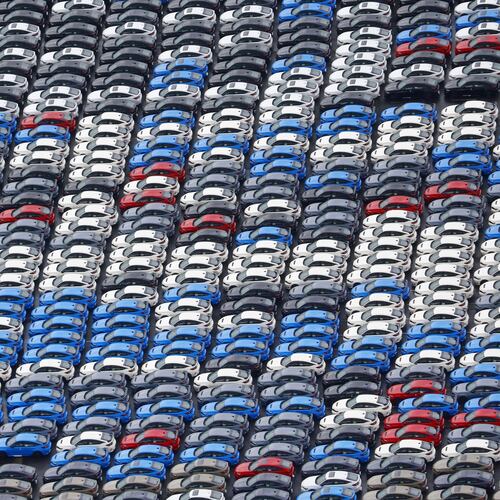 FILE - Vehicles are parked for export at a Yokohama port, near Tokyo on Aug. 1, 2025. (Takuto Kaneko/Kyodo News via AP, File)
