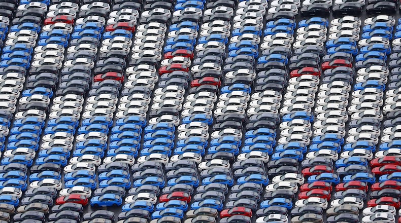 FILE - Vehicles are parked for export at a Yokohama port, near Tokyo on Aug. 1, 2025. (Takuto Kaneko/Kyodo News via AP, File)