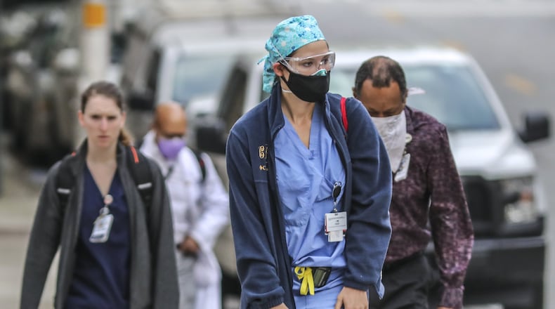 Grady hospital medical personnel arrive for work on Tuesday, April 7, 2020. JOHN SPINK/JSPINK@AJC.COM