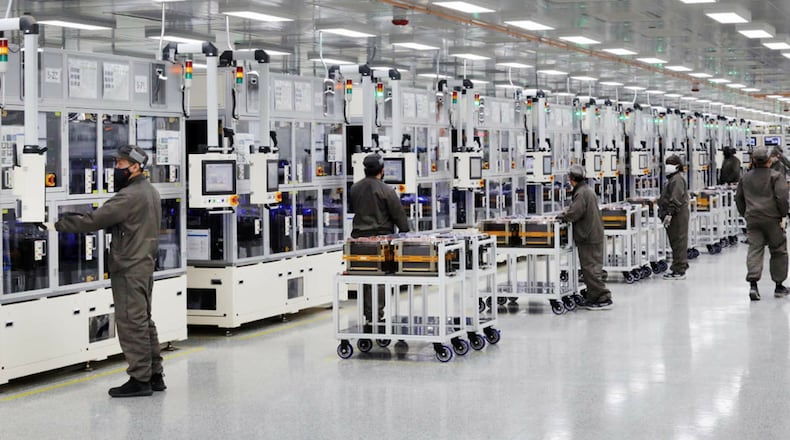 Workers make lithium-ion batteries for electric vehicles at the SK Battery America plant in Jackson County. (SK Battery America)