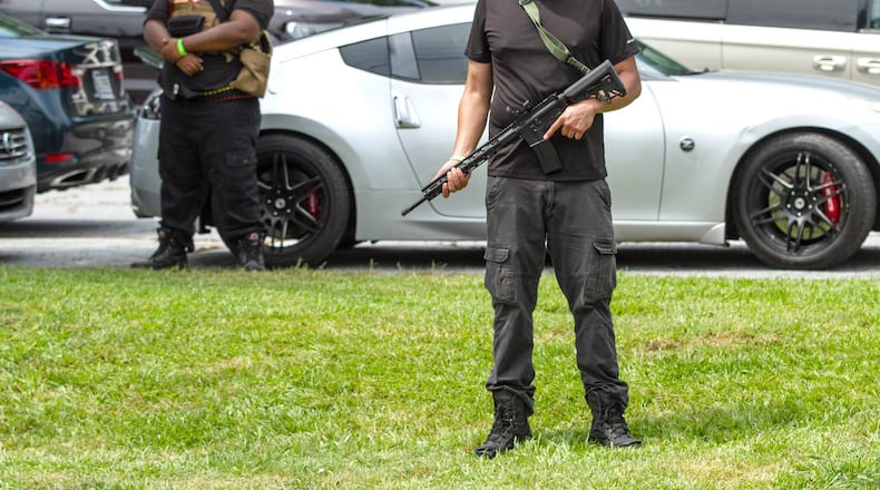 People stand in the parking lot at the Georgia Lautu Baptist Church in Stone Mountain Saturday, July 4, 2020. STEVE SCHAEFER FOR THE ATLANTA JOURNAL-CONSTITUTION