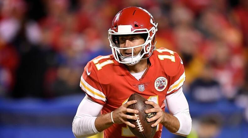 Kansas City Chiefs quarterback Alex Smith (11) rolls out for a 3-yard touchdown pass to Kareem Hunt against the Los Angeles Chargers on December 16, 2017, at Arrowhead Stadium in Kansas City, Mo. (David Eulitt/Kansas City Star/TNS)