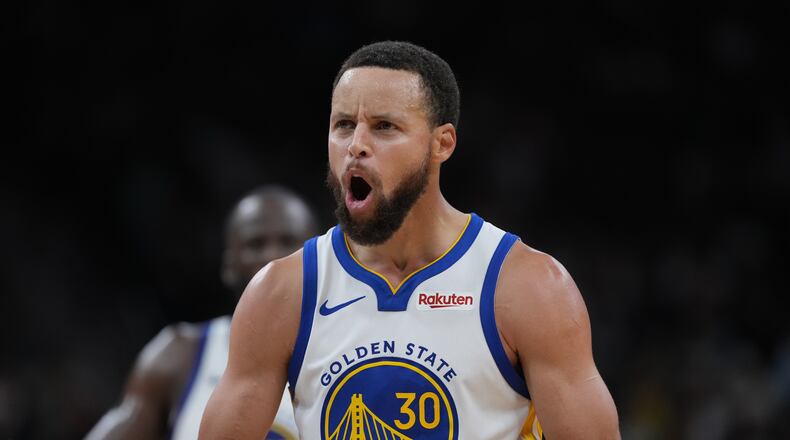 Golden State Warriors guard Stephen Curry (30) reacts after scoring against the San Antonio Spurs during the second half of an NBA basketball game in San Antonio, Wednesday, Nov. 12, 2025. (AP Photo/Eric Gay)