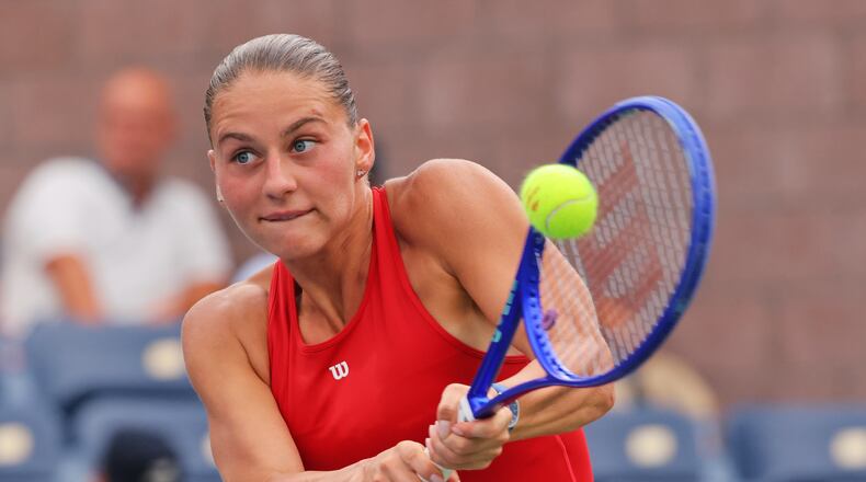 Marta Kostyuk, of Ukraine, returns the ball to Storm Hunter, of Australia, during the first round of the U.S. Open tennis championships, Sunday, Aug. 30, 2026, in New York. (AP Photo/Andres Kudacki)