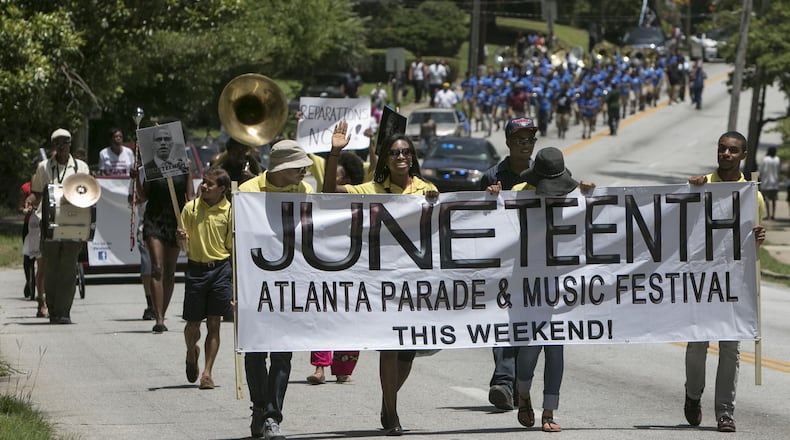 A Juneteenth Parade makes its way down Martin Luther King Jr. Drive in Atlanta. Juneteenth Day -- June 19 -- commemorates the end of slavery. (Photo by Phil Skinner)