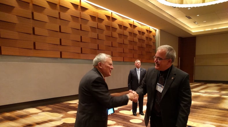 Sept. 8, 2016. Gov. Nathan Deal, left, greeted state Superintendent Richard Woods at the Atlanta Marriott Marquis before speaking at the Georgia Education Leadership Institute, an annual conference for superintendents, school board members, principals and other education leaders. Deal promoted his education agenda, which includes a state takeover of “chronically failing” schools. TY TAGAMI/AJC