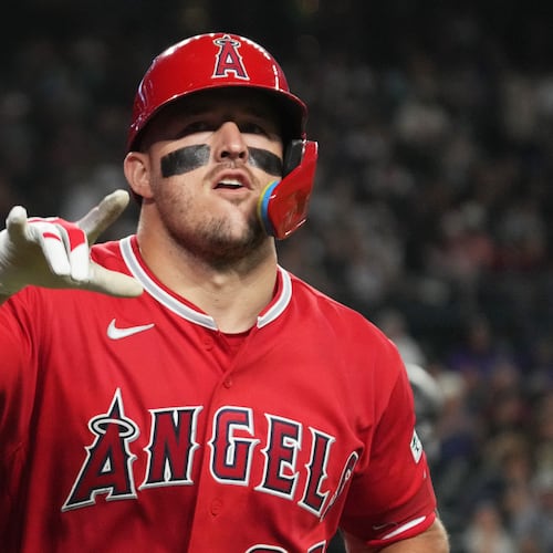 Los Angeles Angels' Mike Trout (27) reacts after hitting a two-run home run against the Arizona Diamondbacks in the fifth inning of a baseball game, Tuesday, June 16, 2026, in Phoenix. (AP Photo/Rick Scuteri)