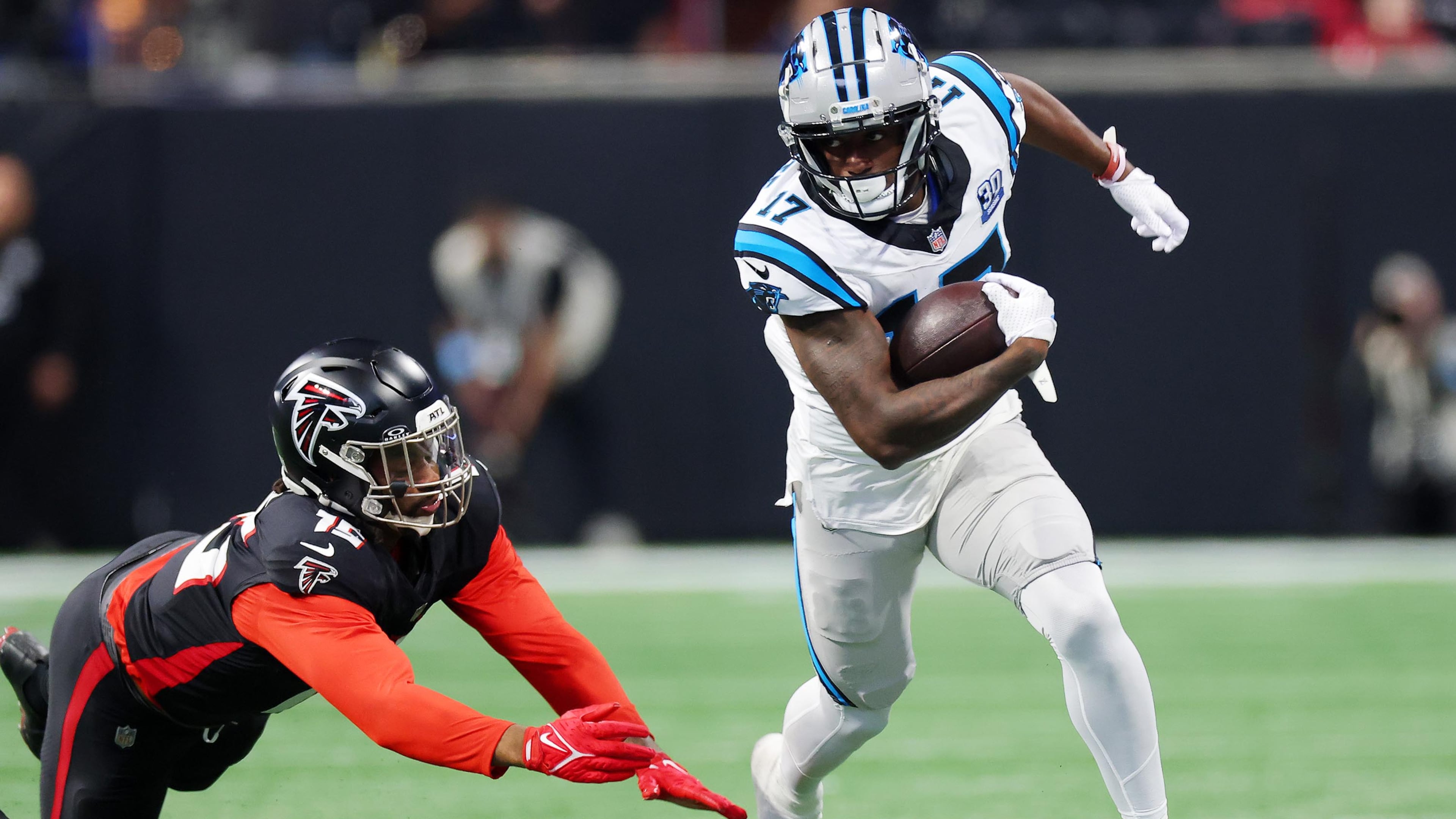 Panthers wide receiver Xavier Legette, pictured running after a catch against the Falcons in January, will miss Sunday's game against Atlanta because of a hamstring injury. (Kevin C. Cox/TNS 2025)