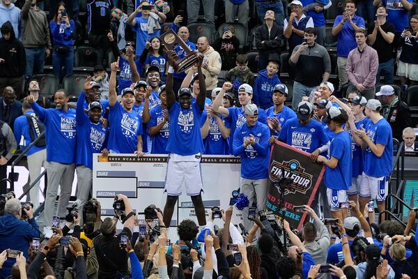 Duke center Khaman Maluach (9) holds up at the East Region championship trophy after Duke defeated Alabama in an Elite Eight round NCAA college basketball tournament game, Saturday, March 29, 2025, in Newark, N.J. (AP Photo/Julia Demaree Nikhinson)