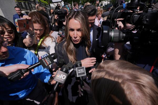 Karen Read is surrounded by media while departing with her attorney Alan Jackson as the jury deliberates at her trial at Norfolk Superior Court, Monday, June 16, 2025, in Dedham, Mass. (AP Photo/Charles Krupa)