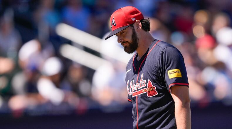Atlanta Braves pitcher Ian Anderson walks to the dugout after being pulled in the second inning of a spring training baseball game against the Tampa Bay Rays in North Port, Fla., Sunday, Feb. 23, 2025. (AP Photo/Gerald Herbert)