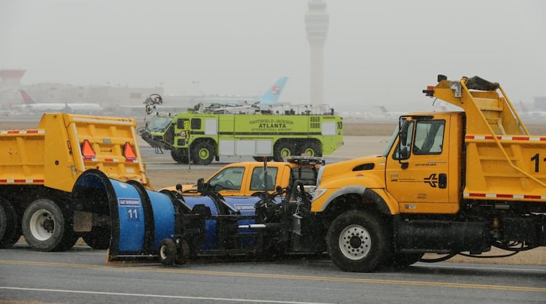 During the 2014 snowstorm, this was the scene from Hartsfield-Jackson International Airport Tuesday as the snow began to fall. JOHN SPINK / JSPINK@AJC.COM