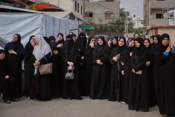 Mourners attend the funeral of their relatives who were killed in an Israeli bombardment, in Deir al-Balah, Gaza Strip, Saturday, July 12, 2025. (AP Photo/Abdel Kareem Hana)
