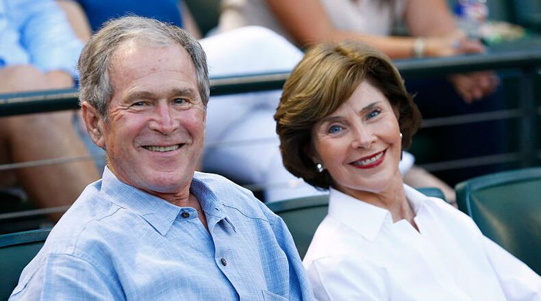 Former U.S. president George W. Bush and former first lady Laura Bush wait for the start of the September 19, 2015, game between the Seattle Mariners and the Texas Rangers at Globe Life Park in Arlington, Texas.