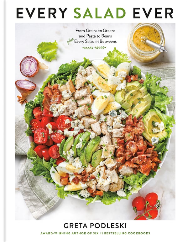 a cookbook titled Every Salad Ever, featuring a bowl of salad with lettuce, avocado, tomato, egg and proteins
