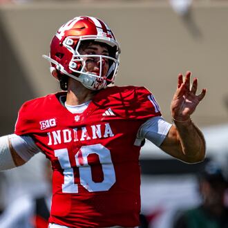 A bloodied Indiana quarterback Josh Hoover (10) looks to pass during the first half of an NCAA college football game against North Texas, Saturday, Sept. 5, 2026, in Bloomington, Ind. (AP Photo/Doug McSchooler)