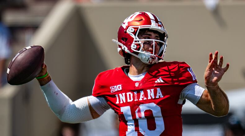 A bloodied Indiana quarterback Josh Hoover (10) looks to pass during the first half of an NCAA college football game against North Texas, Saturday, Sept. 5, 2026, in Bloomington, Ind. (AP Photo/Doug McSchooler)