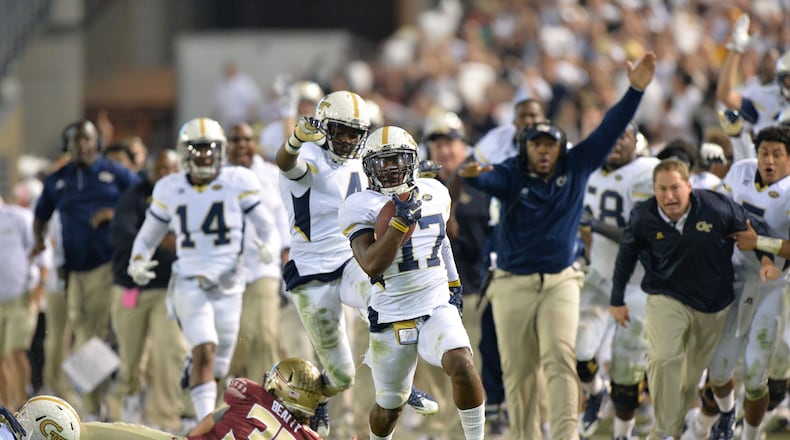 Yellow Jackets defensive back Lance Austin (center) runs for a touchdown after the Seminoles placekicker Roberto Aguayo's field goal was blocked at the end of the fourth quarter at Bobby Dodd Stadium, Saturday, Oct. 24, 2015. The Yellow Jackets won 22-16. (Hyosub Shin/AJC)