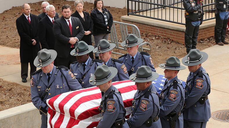 December 11, 2016, AMERICAS: Americus police officer Nicholas Ryan Smarr arrives by honor guard to his funeral service at the Georgia Southwestern State University Storm Dome on Sunday, Dec. 11, 2016, in Americas. Officer Smarr and Georgia Southwestern State University campus police officer Jody Smith were killed responding to a domestic dispute.   Curtis Compton/ccompton@ajc.com