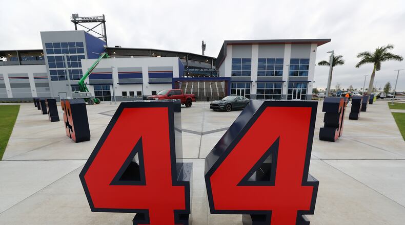 Braves retired numbers, including Hank Aaron's 44, are placed in the plaza in front of the ticket windows and merchandise store seen during a tour of CoolToday Park on Wednesday, March 20, 2019, in Venice, Florida. (Curtis Compton/ccompton@ajc.com)
