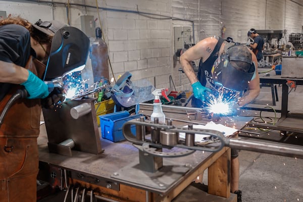 Welders work in the fabrication area at Highland Forge, a hardware manufacturer on Thursday, July 24, 2025. (Natrice Miller/ AJC)