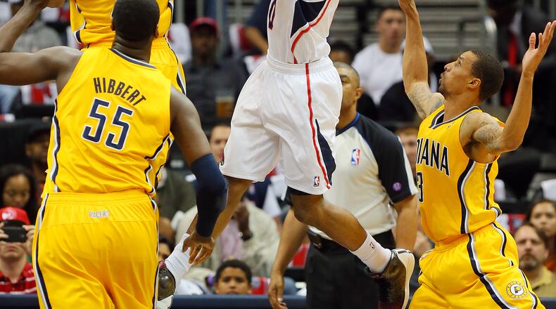 Pacers David West blocks a shot by Hawks Jeff Teague during the first half on Friday, May 3, 2013, in Atlanta.