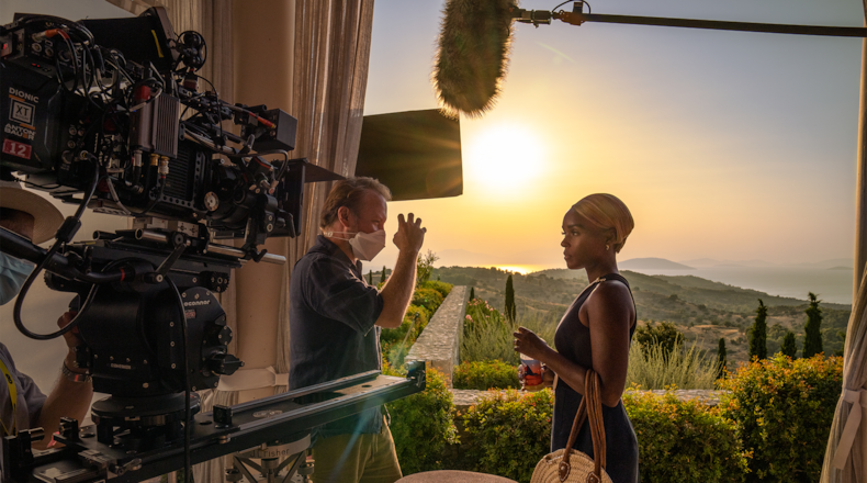 Director Rian Johnson advises Janelle Monae during the filming of "Glass Onion: Knives Out" in Greece in 2021. John Wilson/NETFLIX