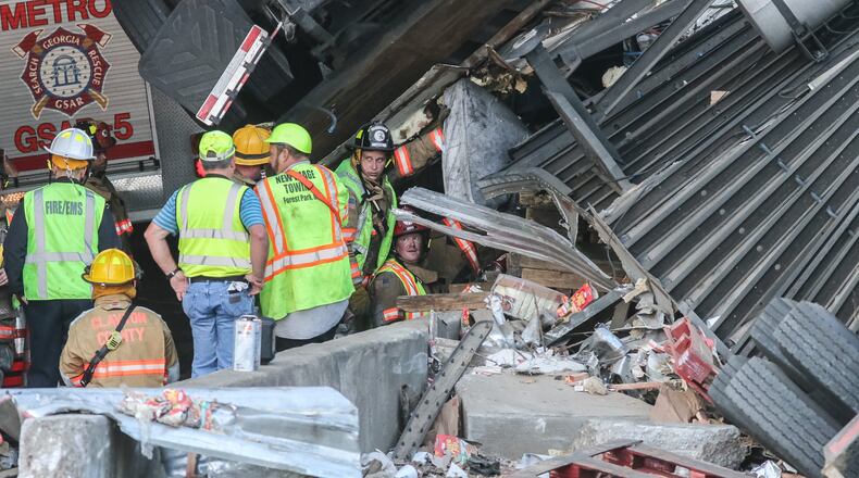 The tractor-trailer struck an overpass. JOHN SPINK / JSPINK@AJC.COM