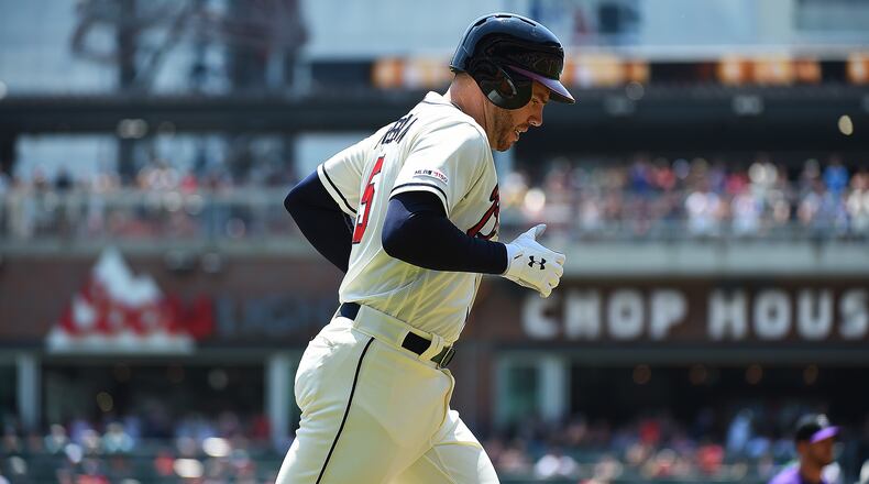 Braves first baseman Freddie trots home after hitting a home run April 28, 2019, against the Colorado Rockies at SunTrust Park in Atlanta.