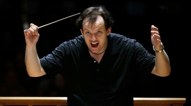 FILE - Boston Symphony Orchestra music director Andris Nelsons rehearses with the orchestra at Symphony Hall, Nov. 20, 2014, in Boston. (AP Photo/Steven Senne, File)